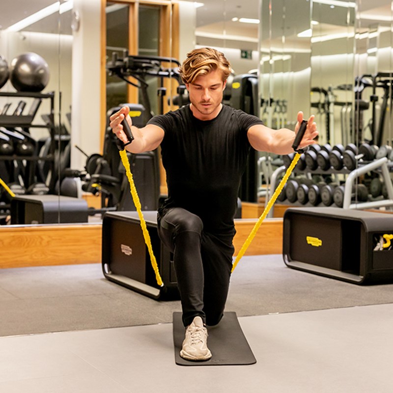 The Connaught Gym, Man working out on a mat with a band