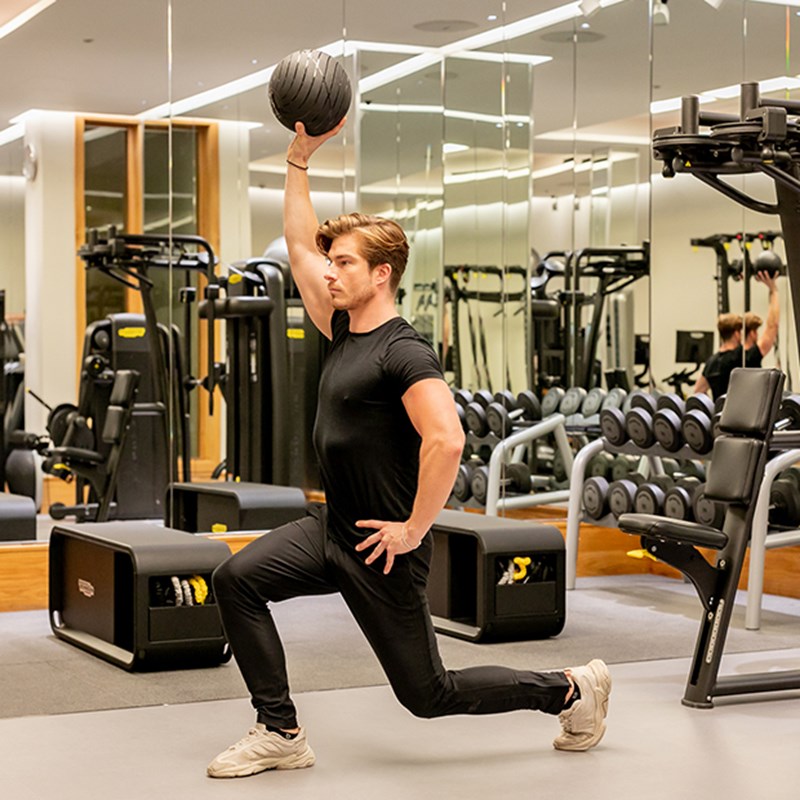 The Connaught Gym, Man workout out on a mat with a ball