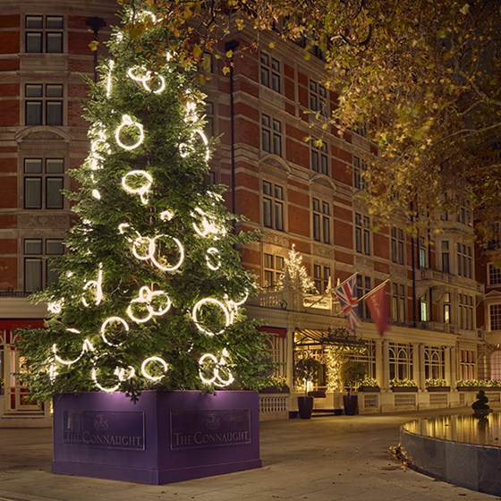 Christmas tree at The Connaught 2023 by Dame Rachel Whiteread; it stands 31 feet tall and features 102 circular neon white loops