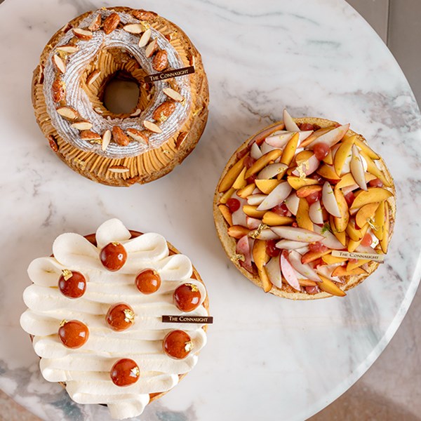 Three cakes on a table at The Connaught Patisserie