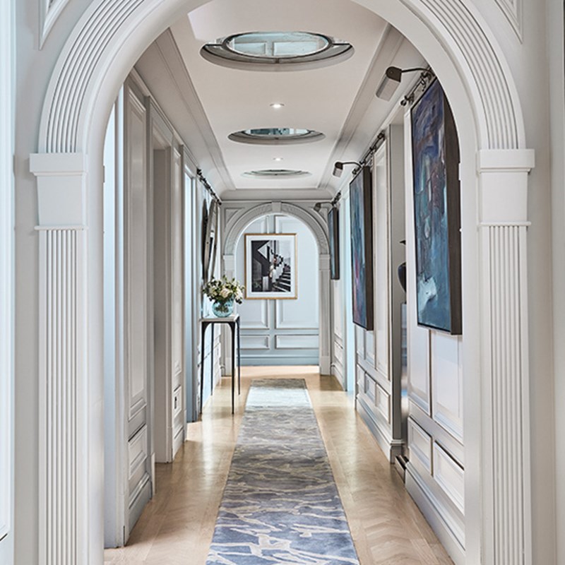 The Apartment corridor with art on the walls